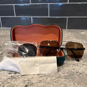 Gucci GG0529S 002 Unisex Sunglasses includes two sets of lenses